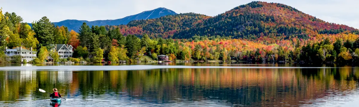 View of Mirror Lake in Lake Placid, New York, with a canoe