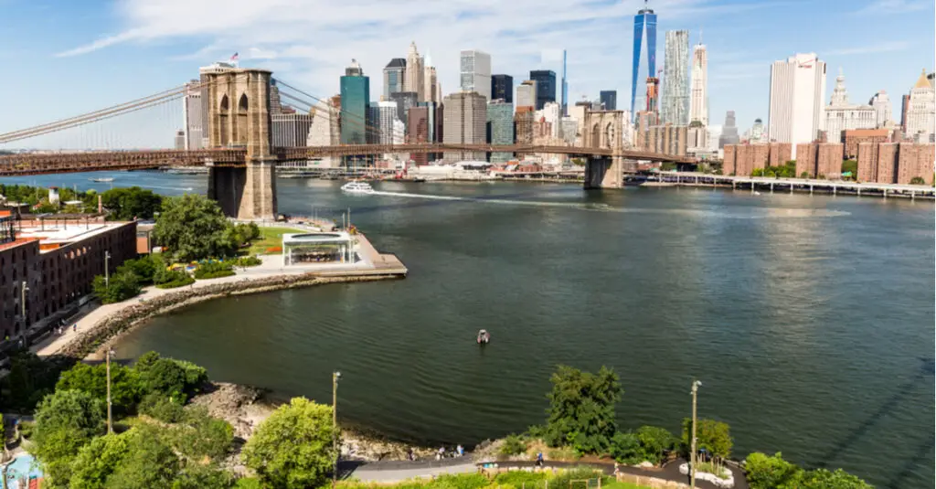 Aerial view of Brooklyn Bridge Park, with the East River, Brooklyn Bridge Park and downtown Manhattan in the background.